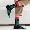 32 pairs unisex Christmas crew socks with festive patterns, soft polyester blend, and mid-calf length