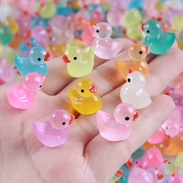 Glow-in-the-dark mini duck figurines, assorted colors, resin-crafted, available in 40/52/99pcs, perfect for party favors, Easter, Halloween, Christmas, and birthday gifts.