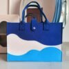 Chic colorblock felt tote bag for women with large capacity, secure closure, and wrist strap.