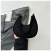 Fashion top-handle handbag for women in black, khaki, and green with solid color design, fixed shoulder straps, faux leather lining, and zipper closure.