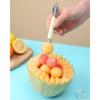 Stainless steel watermelon baller and carving knife, designed for effortlessly scooping and carving watermelon.