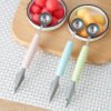 Stainless steel watermelon baller and carving knife, designed for effortlessly scooping and carving watermelon.