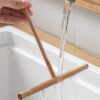 Bamboo T-shaped pancake spreader, reusable and easy to clean, perfect for home and professional use.