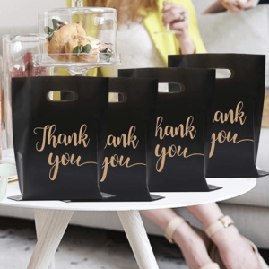 100pcs black reusable plastic shopping bags, perfect for thank you gifts, Christmas, parties, stores, and boutiques.