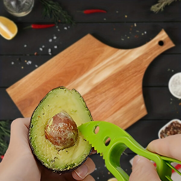 Multifunctional avocado slicer and peeler tool with ergonomic handle for easy cutting and peeling.