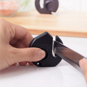 Portable mini knife sharpener for quick and easy sharpening of kitchen knives.