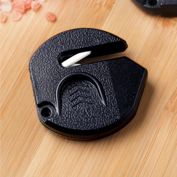 Portable mini knife sharpener for quick and easy sharpening of kitchen knives.