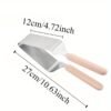 Stainless steel cake clip and slicer set, 27cm, perfect for minimalist food presentation and precise cake serving.