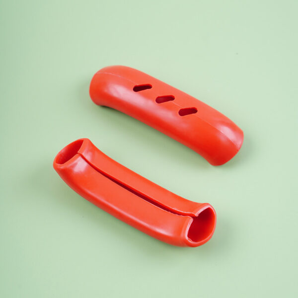 Set of 2 heat-resistant silicone pot handle covers for safe handling of hot cookware.