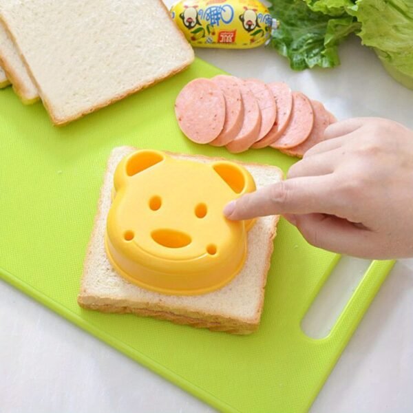 Cartoon animal sandwich cutter set with bento and holiday-themed molds for fun, shaped sandwiches.