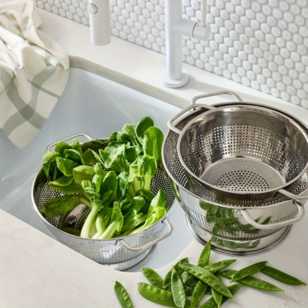 Stainless steel colander set including 1.5QT and 5QT sizes for straining and draining food.