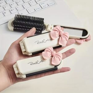 Portable folding comb with air cushion, detachable ivory anti-static mirror, ABS plastic handle, suitable for all hair types.