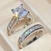 Stylish men's and women's couple jewelry set featuring shiny square cubic zirconia wedding rings, perfect for engagement, anniversaries, or special occasions.