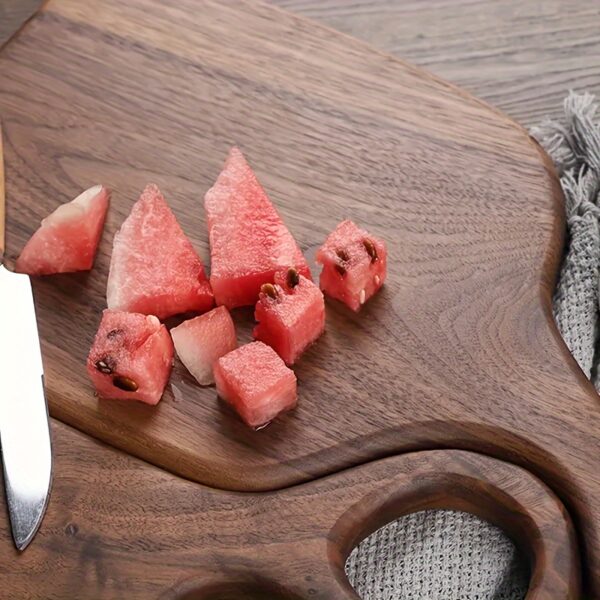 2-piece walnut chopping board set made from solid wood with form-fitting design and hanging hole