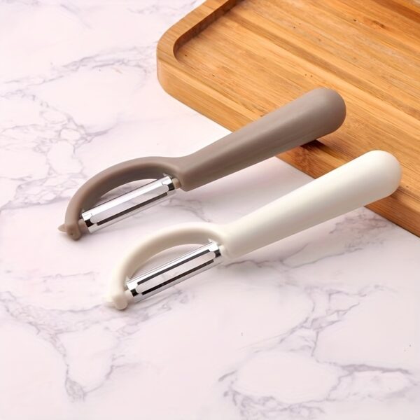 Stainless steel paring knife with multifunctional peeler for precise cutting and peeling.