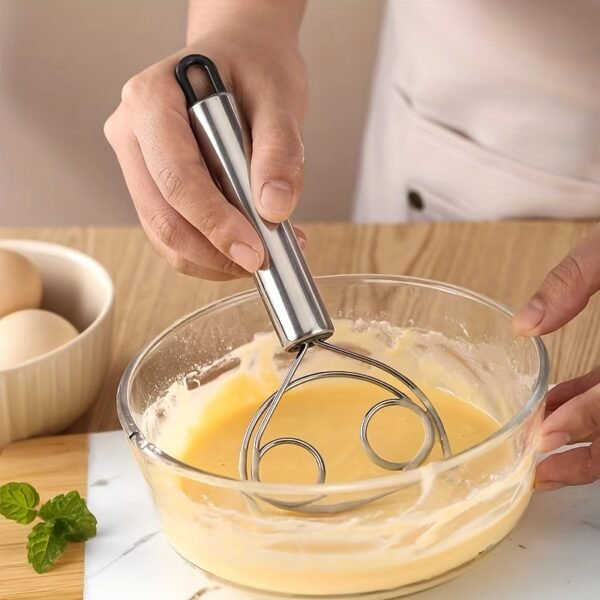 Stainless steel whisk with double-eye rings, perfect for mixing flour, beating cream, and dough mixing in baking and cooking.