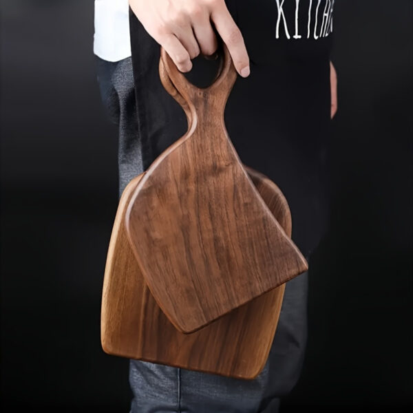 2-piece walnut chopping board set made from solid wood with form-fitting design and hanging hole