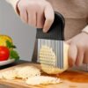 Stainless steel wave-shaped potato slicer, designed for cutting potatoes into wavy, uniform slices.