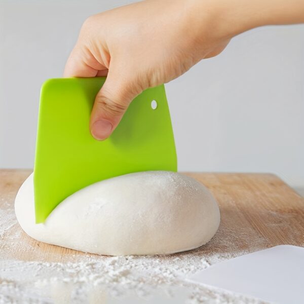 Plastic dough cutter, pastry knife, and bread scraper tool for cutting and shaping dough.