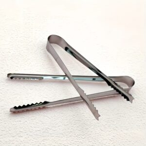 Plastic dough cutter, pastry knife, and bread scraper tool for cutting and shaping dough.