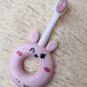 Soft silicone baby toothbrush for toddlers 0-3 years, gentle cleaning with super soft bristles, cute cartoon design.