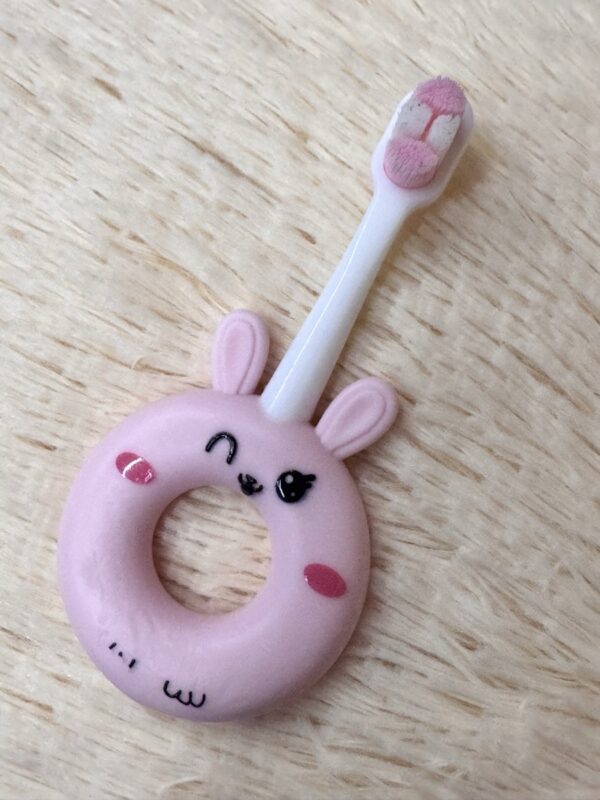 Soft silicone baby toothbrush for toddlers 0-3 years, gentle cleaning with super soft bristles, cute cartoon design.