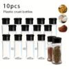 Set of 10 plastic pepper shakers, each with a 100ml capacity, featuring a perforated lid for easy dispensing.