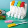 Single silicone spatula butter cream scraper with a flexible, non-stick surface for smooth spreading.