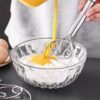 Stainless steel whisk with double-eye rings, perfect for mixing flour, beating cream, and dough mixing in baking and cooking.