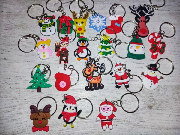 20pcs Christmas-themed keychains featuring Santa, snowman, reindeer, and tree designs made of cute silicone PVC charms.