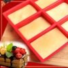 9-cavity silicone mini loaf pan for baking individual portions of bread, cakes, or desserts