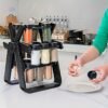 360° rotating spice rack with 18 glass jars, designed for easy access and space-saving storage.