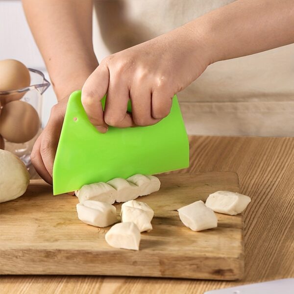 Plastic dough cutter, pastry knife, and bread scraper tool for cutting and shaping dough.