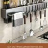 Wall-mounted carbon steel kitchen utensil holder for organizing cooking tools and utensils.