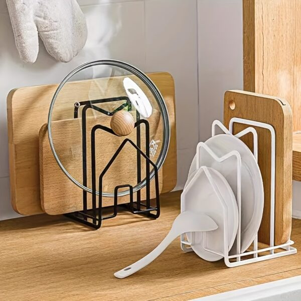 Metal pot lid and cutting board holder for organized kitchen storage.