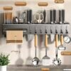 Wall-mounted carbon steel kitchen utensil holder for organizing cooking tools and utensils.