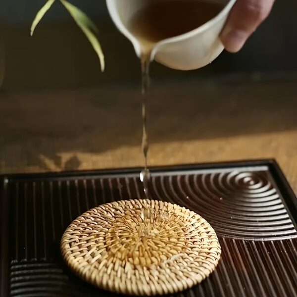 Handcrafted rattan coasters with autumn vine design, perfect for protecting surfaces from drink marks.