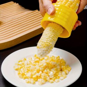 Stainless steel corn cob sheller for easy and manual removal of corn kernels.