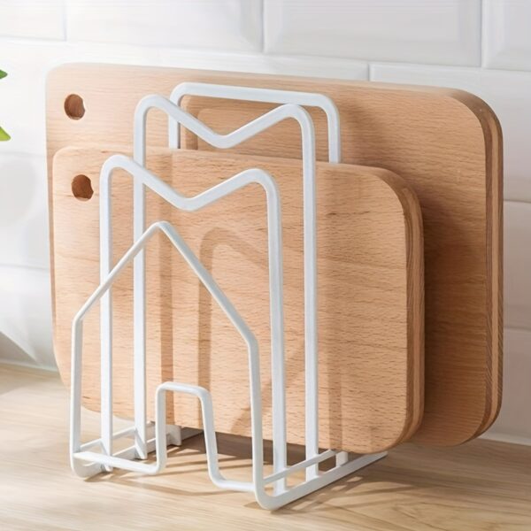 Metal pot lid and cutting board holder for organized kitchen storage.