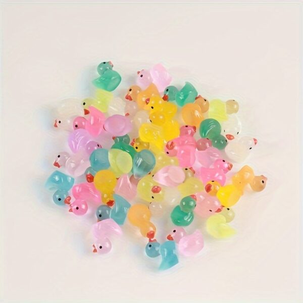 Glow-in-the-dark mini duck figurines, assorted colors, resin-crafted, available in 40/52/99pcs, perfect for party favors, Easter, Halloween, Christmas, and birthday gifts.