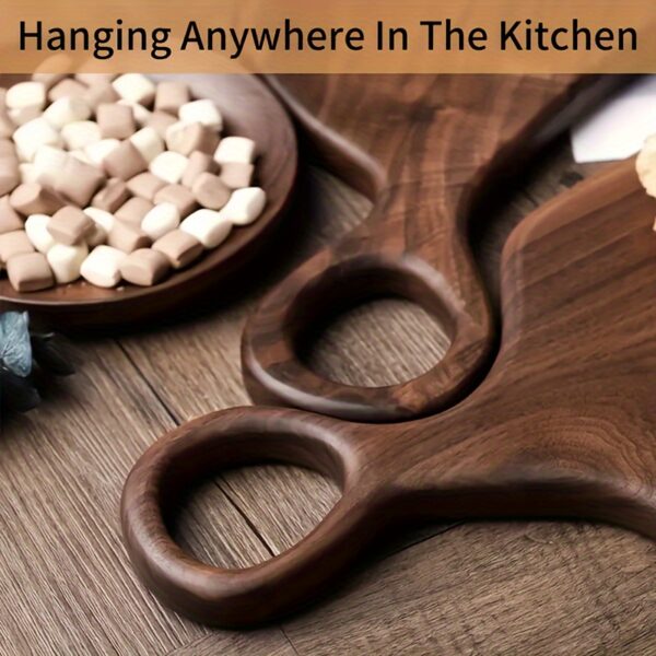 2-piece walnut chopping board set made from solid wood with form-fitting design and hanging hole