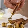 Stainless steel measuring cups and spoons set for precise cooking and baking measurements