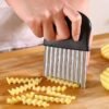 Stainless steel wave-shaped potato slicer, designed for cutting potatoes into wavy, uniform slices.