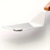 Premium stainless steel spatula set with wooden handles for cooking and flipping.