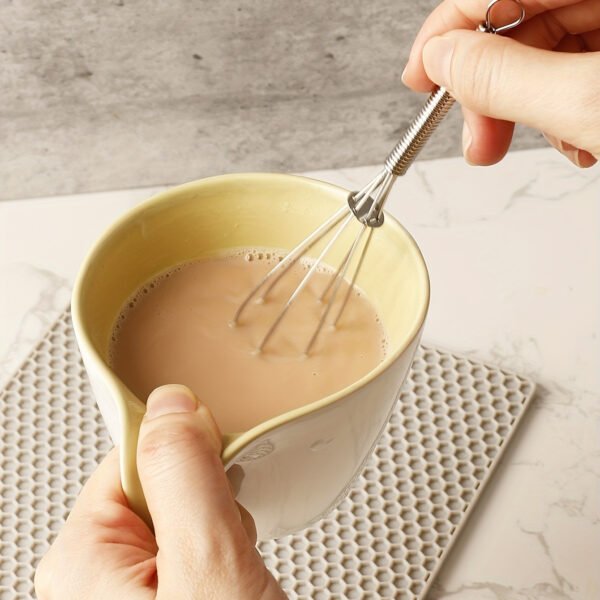 Stainless steel whisk for mixing, whipping, and beating eggs and batter.