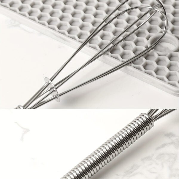 Stainless steel whisk for mixing, whipping, and beating eggs and batter.