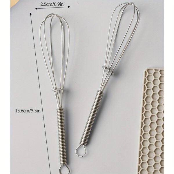 Stainless steel whisk for mixing, whipping, and beating eggs and batter.