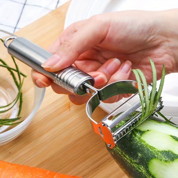 Stainless steel 2-in-1 peeler and shredder tool for peeling and shredding fruits, vegetables, and more.