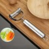 Stainless steel 2-in-1 peeler and shredder tool for peeling and shredding fruits, vegetables, and more.