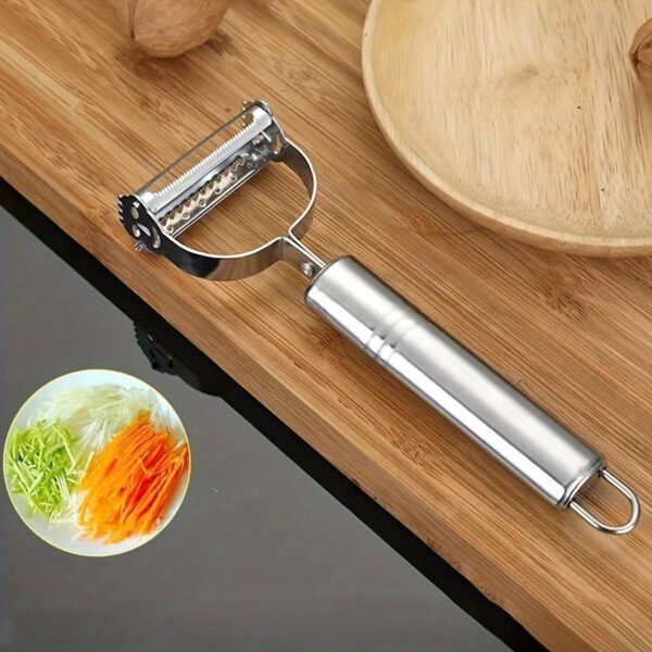 Stainless steel 2-in-1 peeler and shredder tool for peeling and shredding fruits, vegetables, and more.